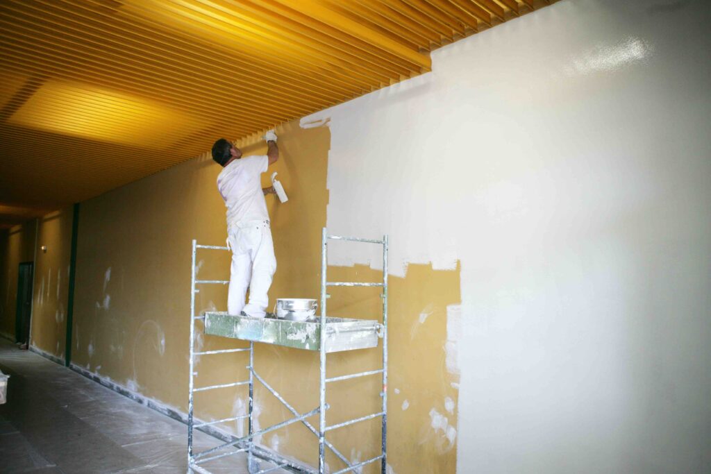 This is how work is done today. A painter on a scaffolding.